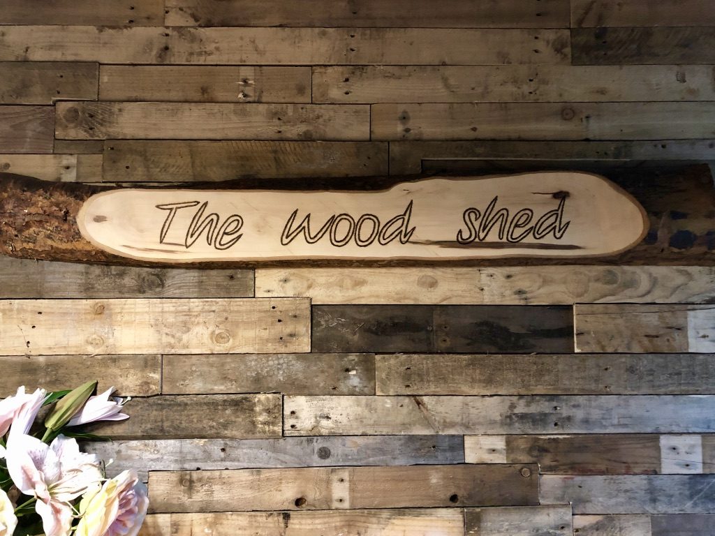 An interior shot showing the name plaque of The Wood Shed